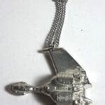 Silver spaceship necklace with chain.