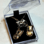 Gold Star Trek pendant necklace in a box.