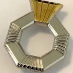 Silver and gold octagonal ring with a crown