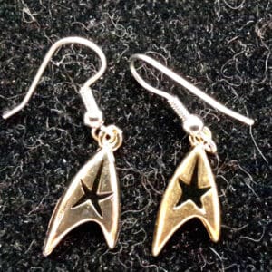 Gold Starfleet earrings with black stars.