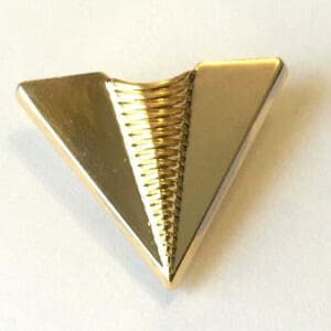 Gold triangular pin with textured center.