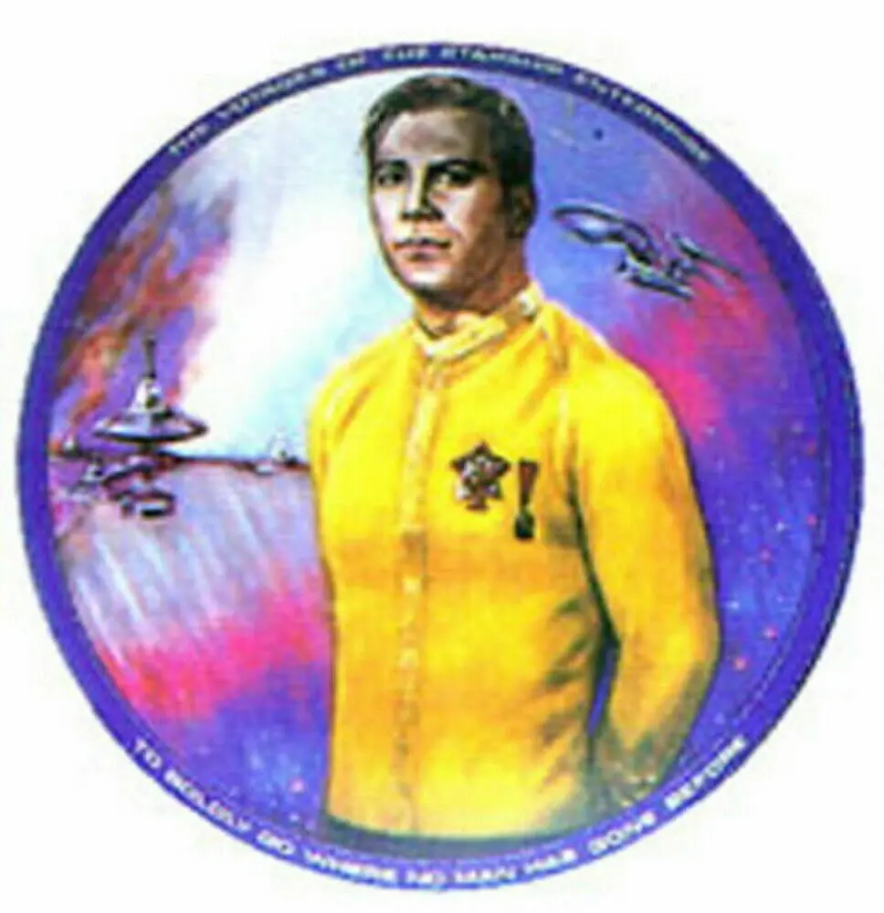 Portrait of a man in a yellow shirt.