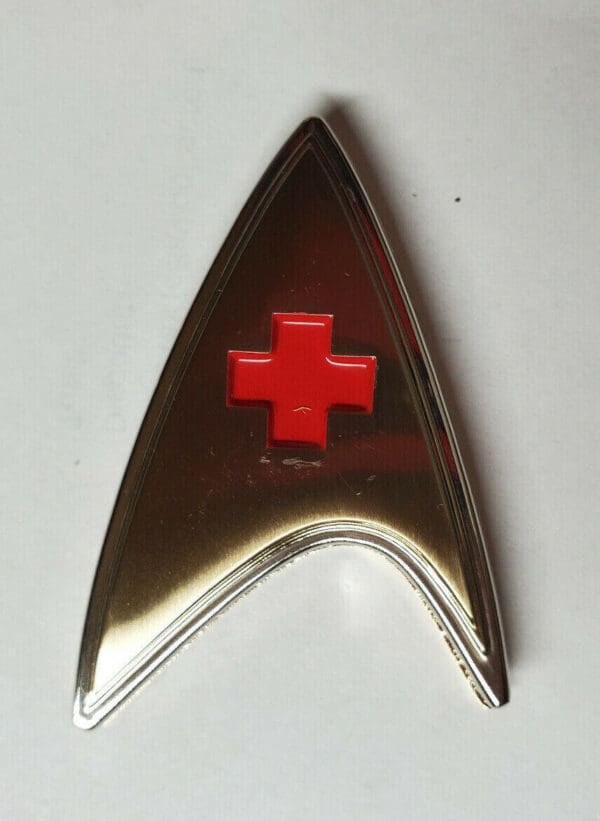 Star Trek medical badge with red cross.