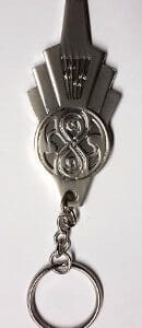 Silver keychain with a Doctor Who symbol.