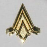 Gold Masonic pin with three triangles.