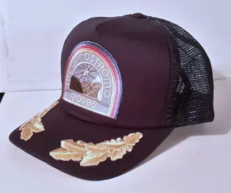 Black trucker hat with Nostromo logo.