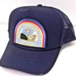 Blue trucker hat with Nostromo logo.