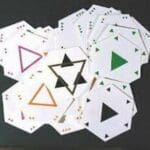 A stack of hexagonal cards with triangles.