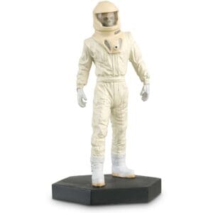 A white-suited astronaut figurine.