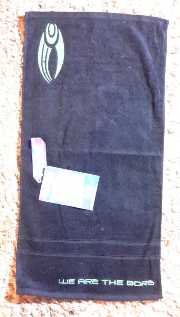 Black Borg towel with green logo.