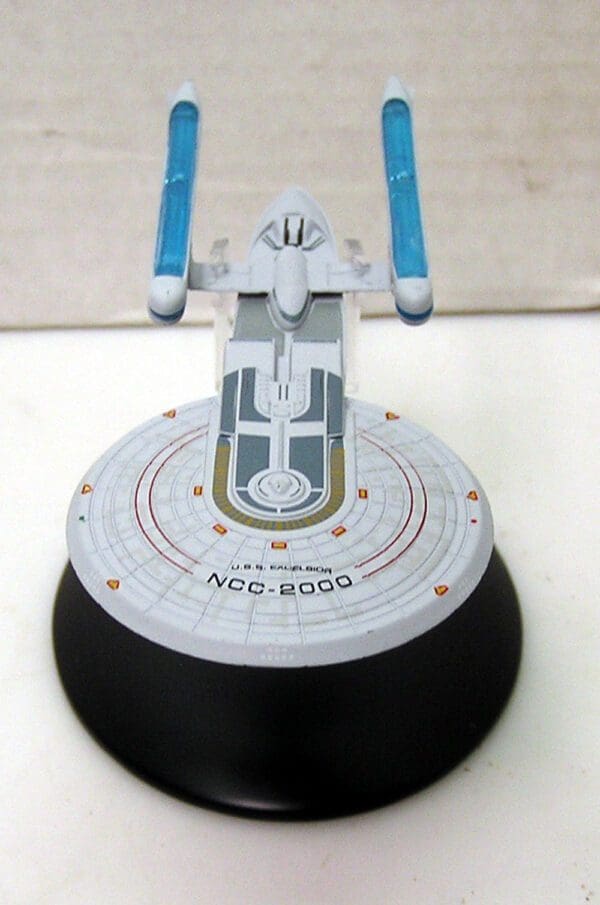 USS Excelsior starship model on a base.