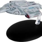 U.S.S. Defiant starship model on stand.