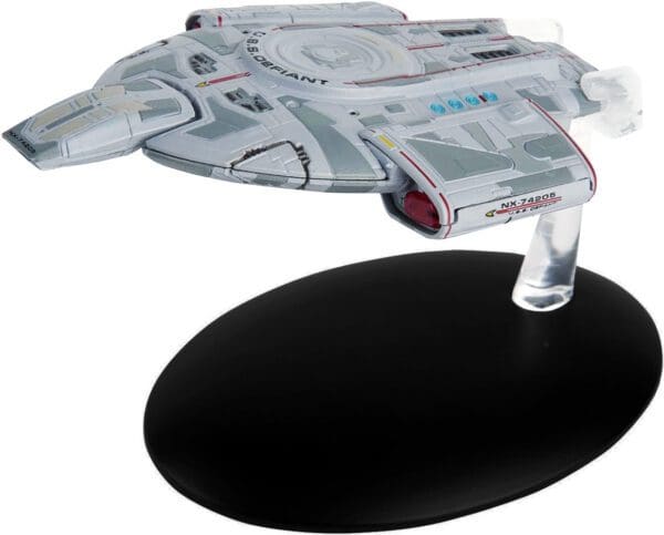 U.S.S. Defiant starship model on stand.