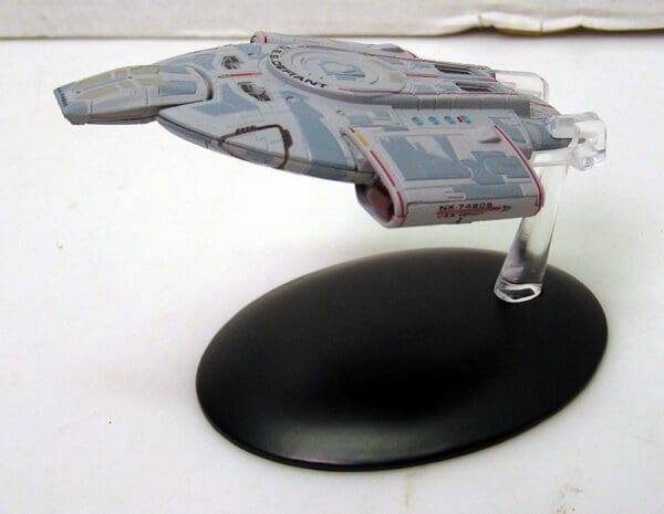 Star Trek Voyager NX-74805 model on stand.