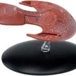 Red Starfleet ship on display stand.