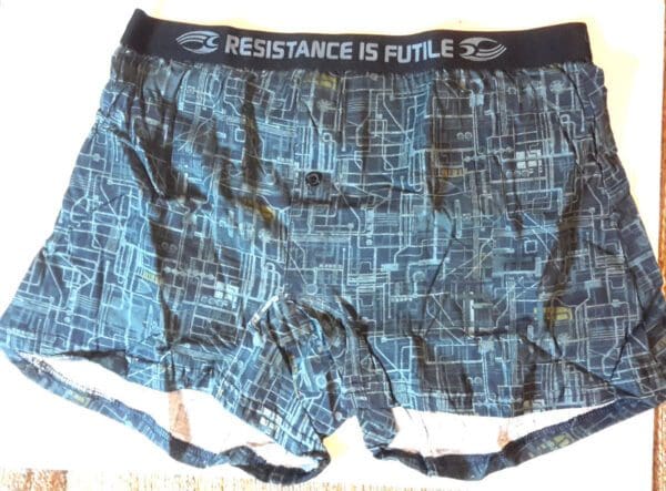 Blue boxer shorts with "Resistance is futile" design.