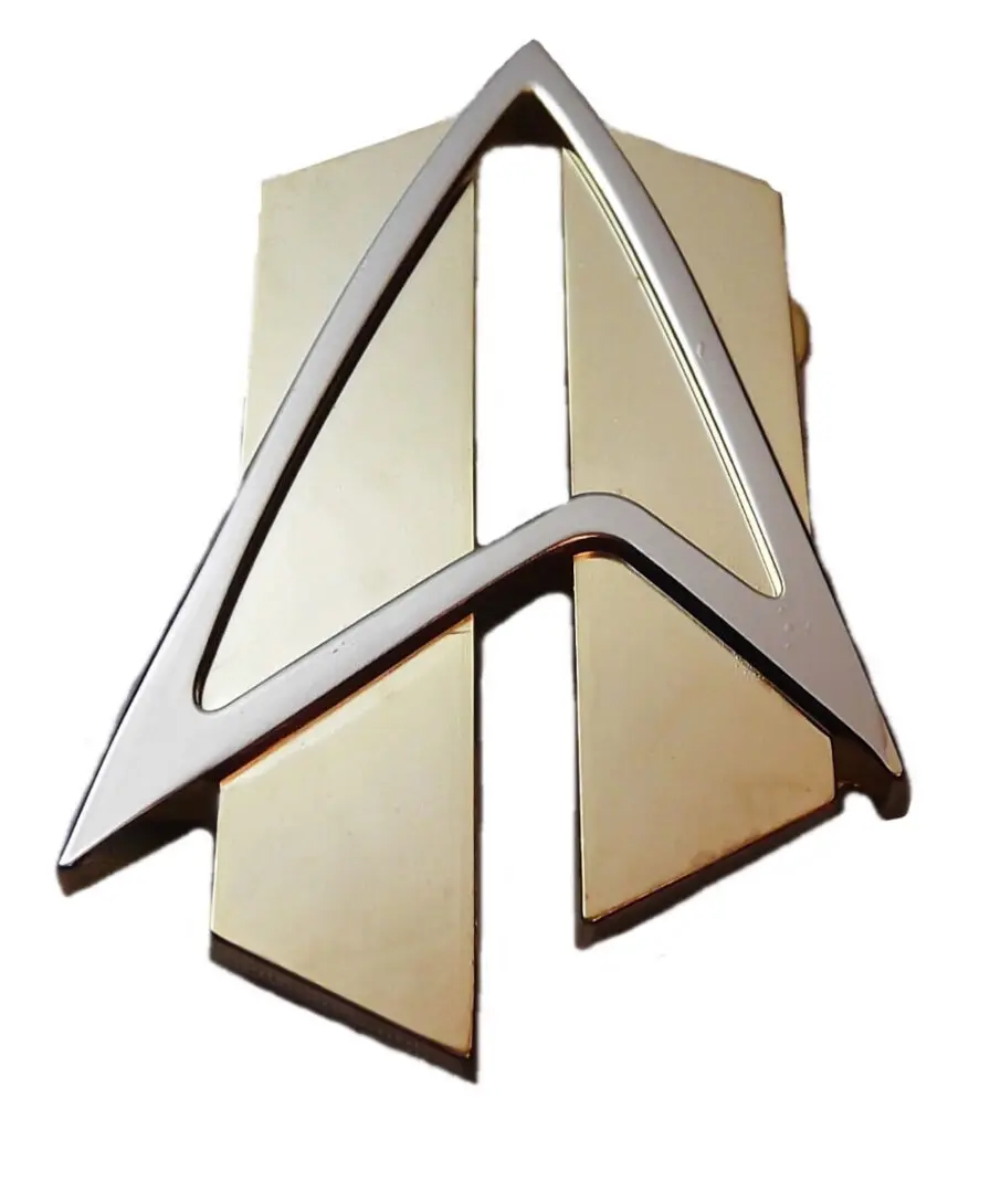 Gold and silver Starfleet emblem.