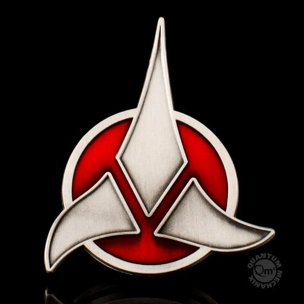 Starfleet insignia with red background.