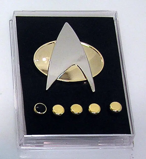 Star Trek insignia display with pins.
