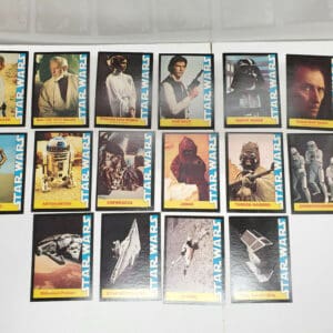 Star Wars trading cards featuring characters and vehicles.