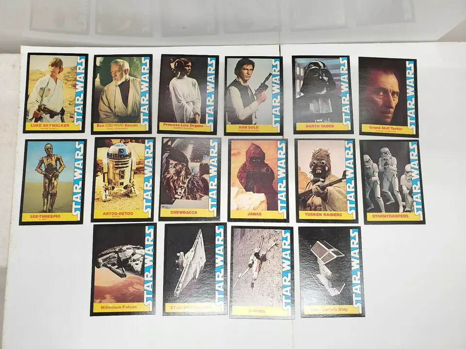 Star Wars trading cards featuring characters and vehicles.