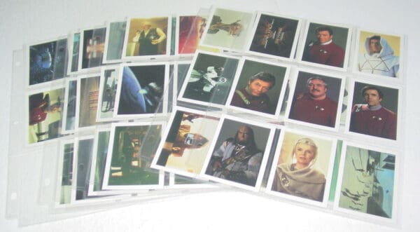 Star Trek trading cards in plastic sleeves.