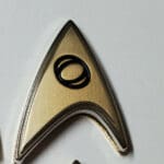 Gold Starfleet insignia with black ring