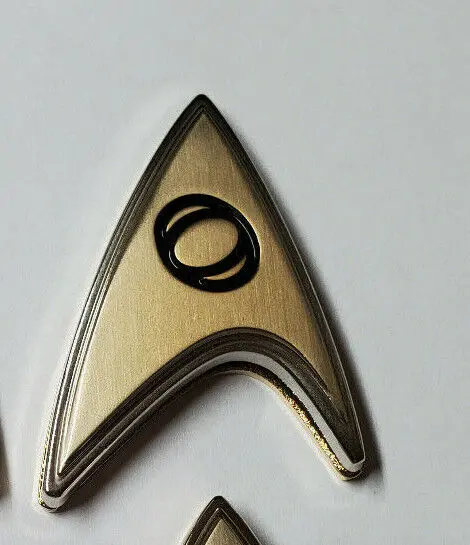 Gold Starfleet insignia with black ring