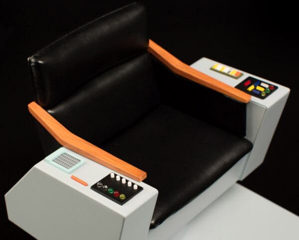 Black leather captain's chair with controls.