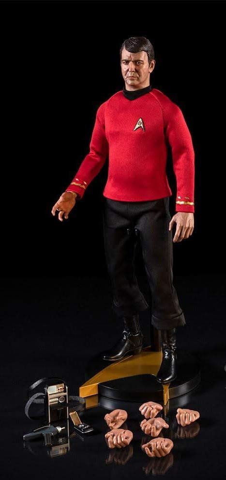 Star Trek action figure in red shirt.