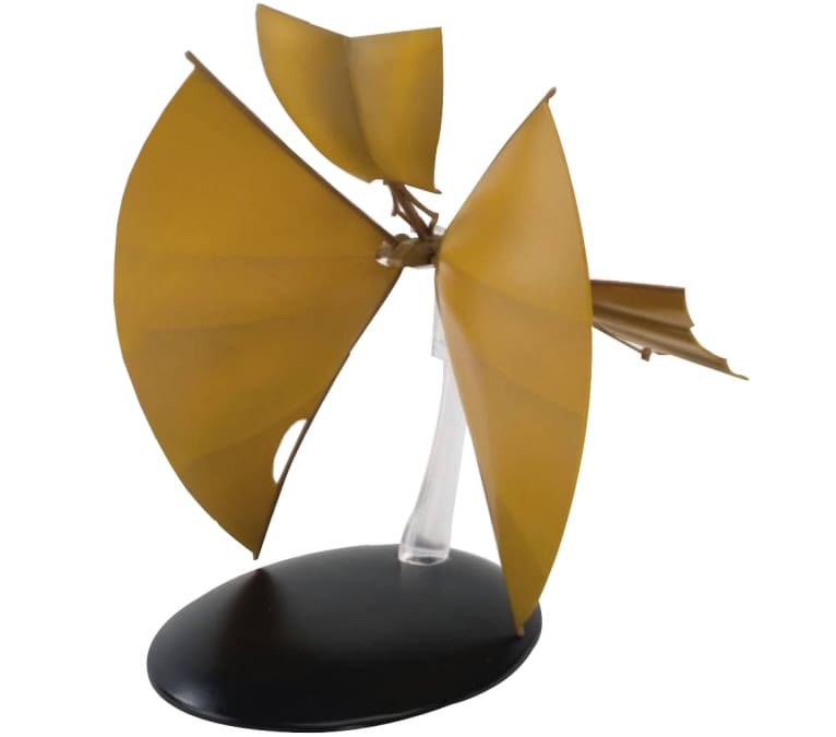 Golden winged spacecraft model on stand.