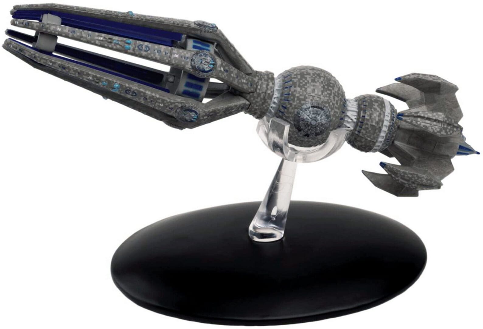 Grey and blue spaceship figurine on stand.