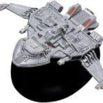 A gray spaceship model with red accents.