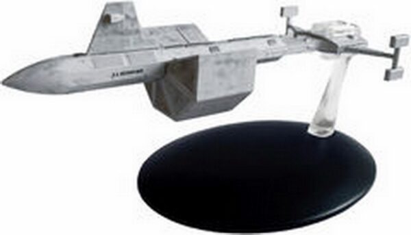 A gray model spaceship on a black stand.