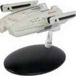 Star Trek Voyager starship model on stand.