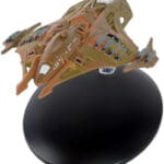 Star Trek: Voyager model on a stand.