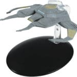 Gray Star Trek ship on a black stand.