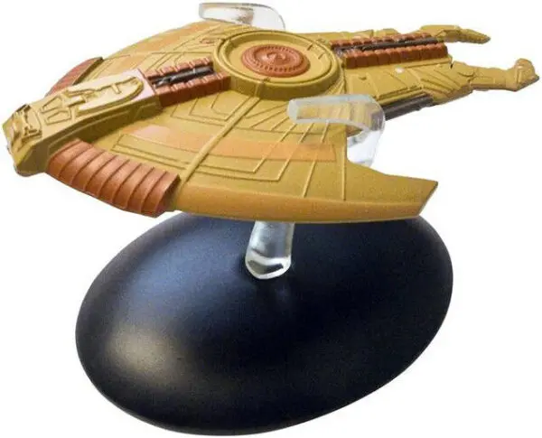 A gold and brown model of a spaceship.