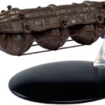 A weathered, rusted, model spaceship.