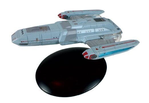 Star Trek: Voyager model starship on stand.