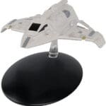 White Starfleet ship model on a stand.