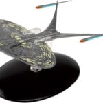 Star Trek Voyager starship model on base.