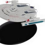 Star Trek Voyager model on a stand.