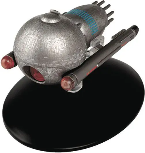 Silver spaceship model on a black base.