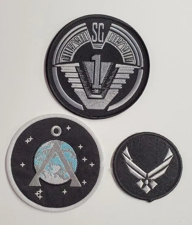 Three embroidered patches from Stargate SG-1.