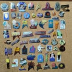 Star Trek enamel pins on cork board.