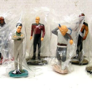 Star Trek figurines in plastic packaging.