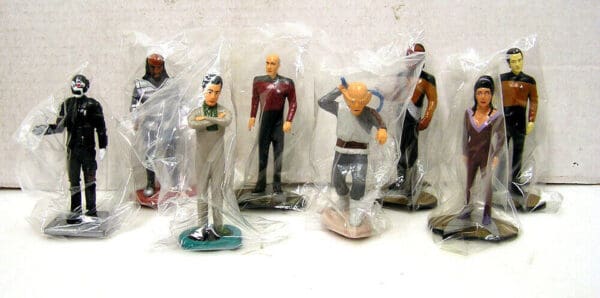 Star Trek figurines in plastic packaging.