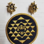 Gold embroidered patch with geometric pattern.