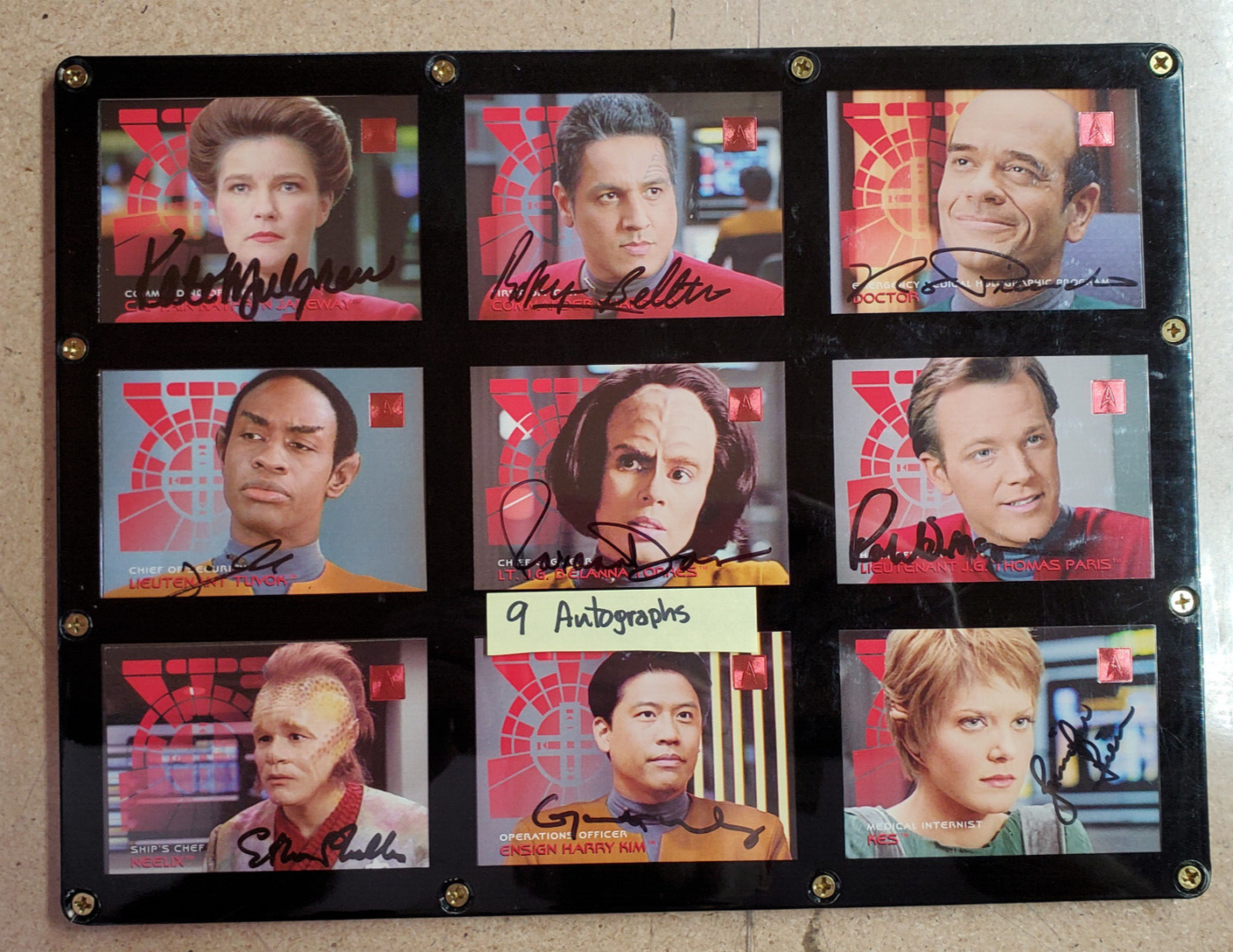 9 Star Trek Voyager autographed trading cards.
